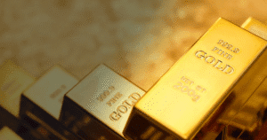 Ouro cai, mas fecha semana com alta em meio à economia americana